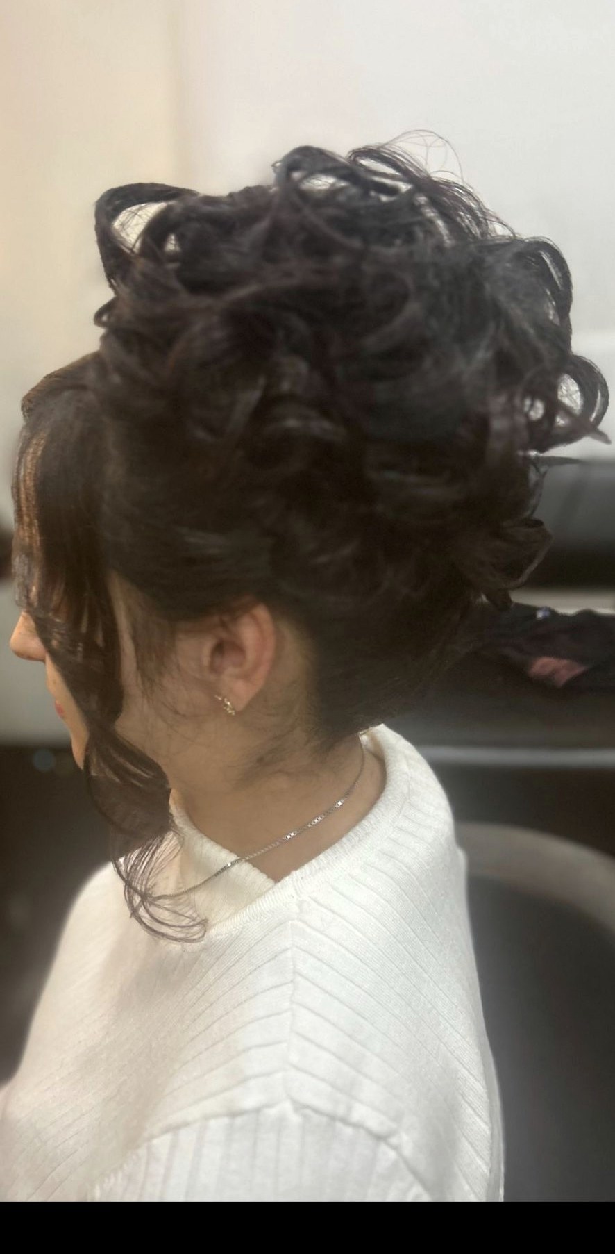 Elegant curled updo styled for a special occasion