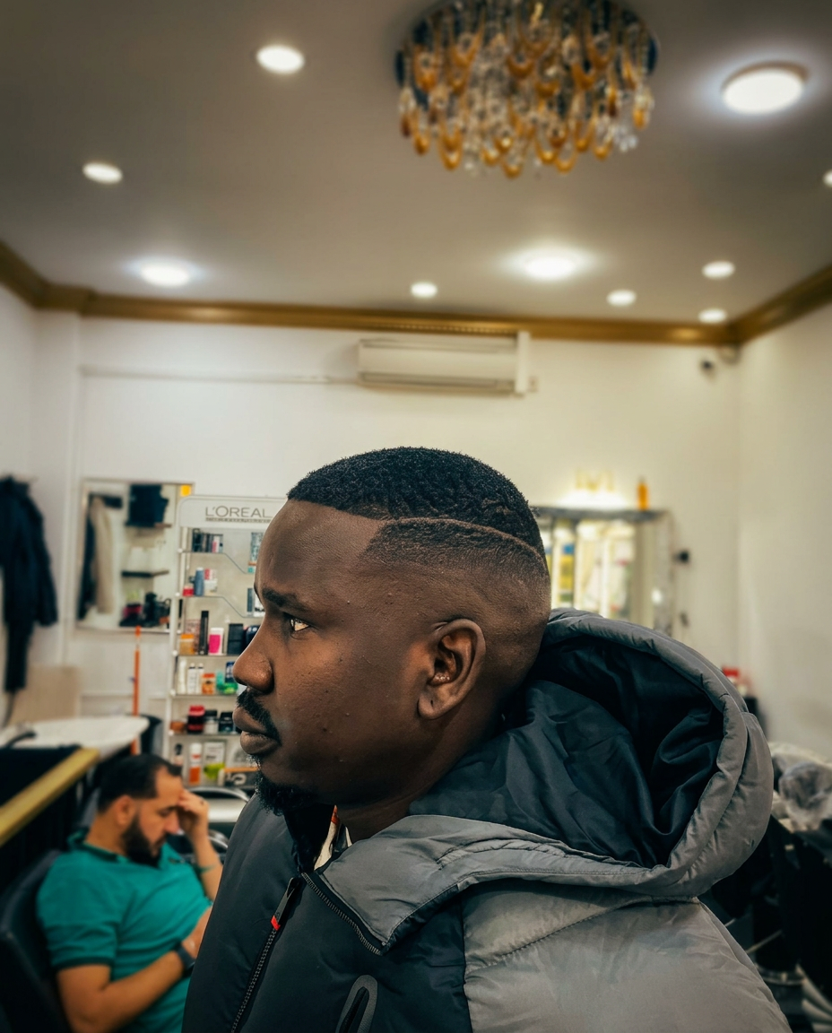 High fade with sharp side parting detail