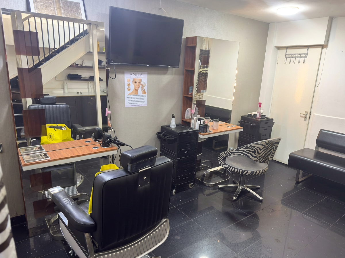 Styling station with barber chair and mirror available to rent at Salon Al-Rayan